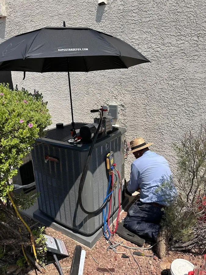 HVAC technician performing outdoor AC maintenance in Santa Fe Springs